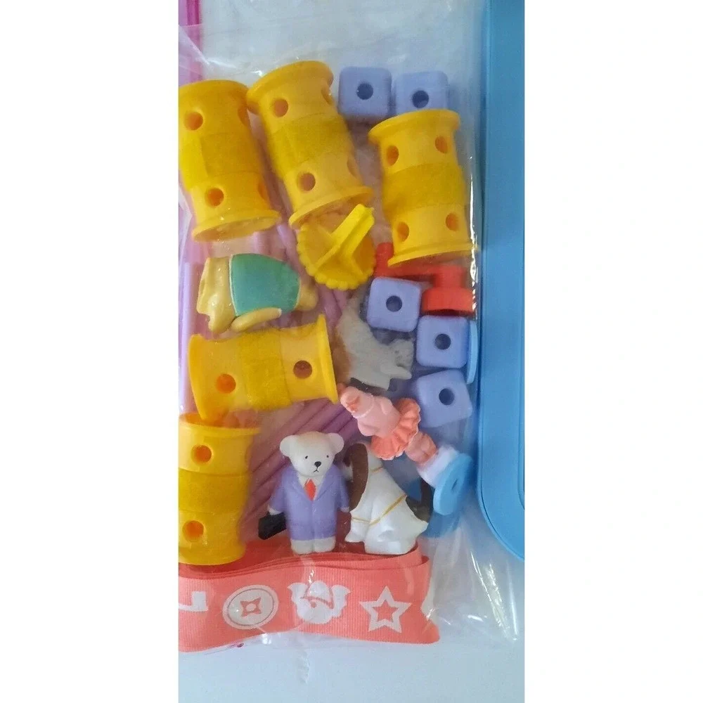 GoldieBlox and the Spinning Machine Engineering Toy Set with Book and 33 Pieces